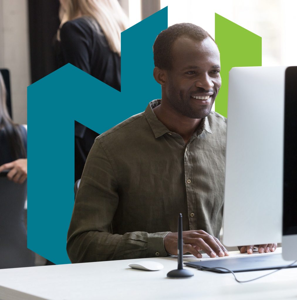 smiling african american businessman working his computer